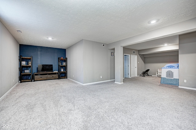 basement with carpet and a textured ceiling