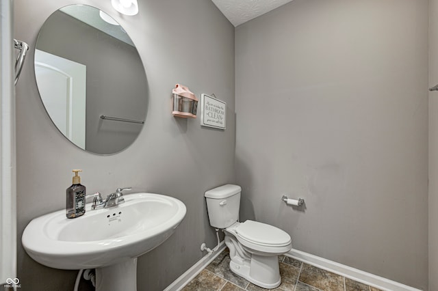 bathroom with sink and toilet