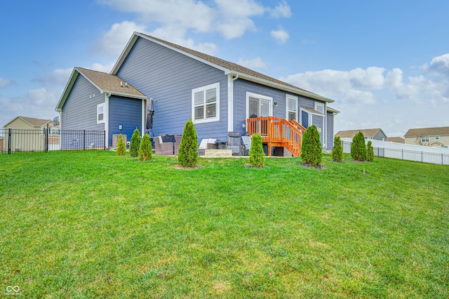 back of house with a lawn