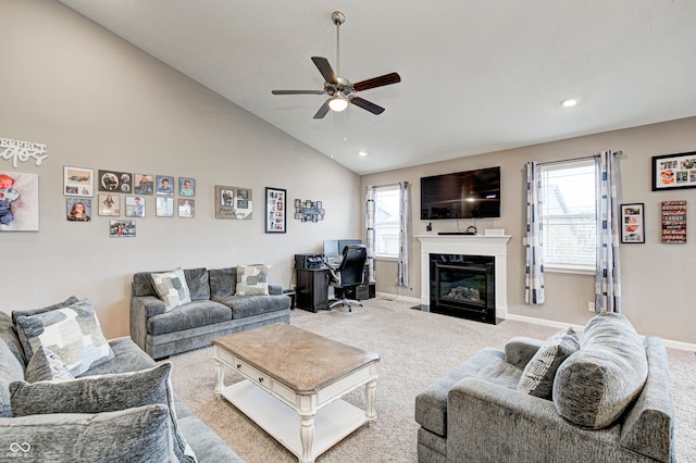 carpeted living room featuring ceiling fan and high vaulted ceiling