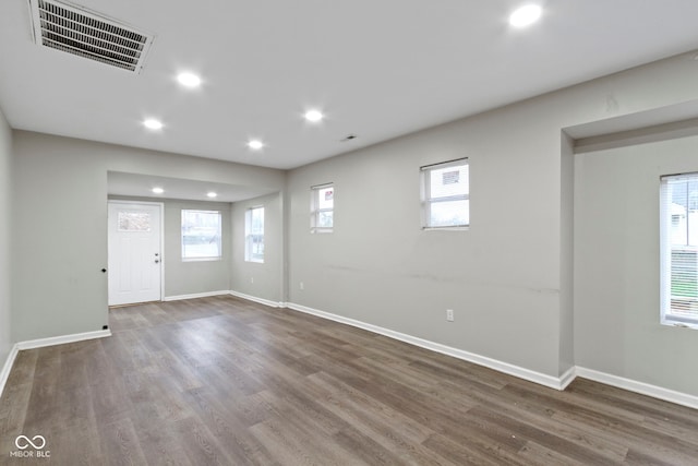 interior space featuring a wealth of natural light and dark wood-type flooring