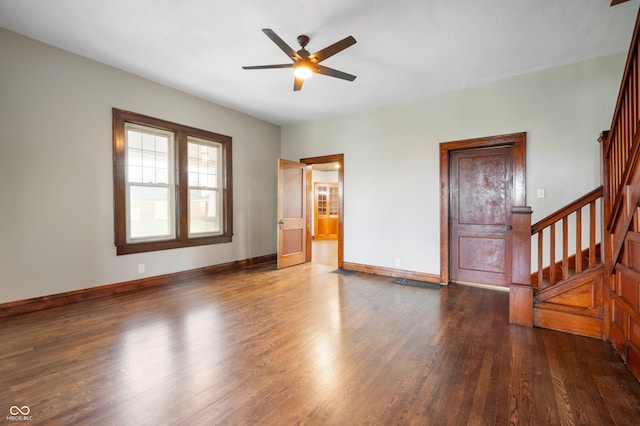 interior space with dark hardwood / wood-style flooring and ceiling fan