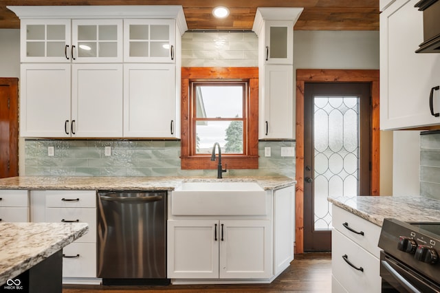 kitchen with white cabinets, appliances with stainless steel finishes, sink, and tasteful backsplash