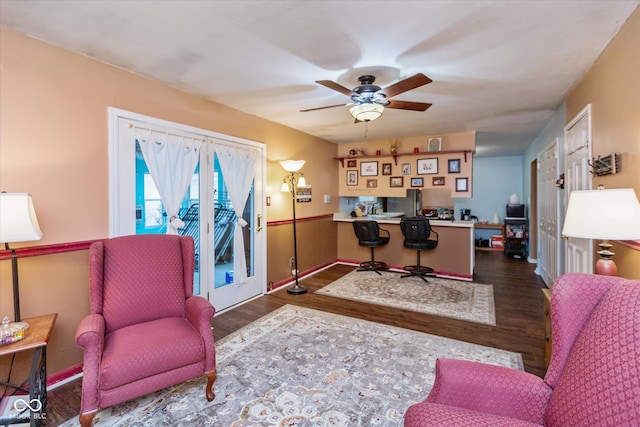 office with dark hardwood / wood-style floors and ceiling fan