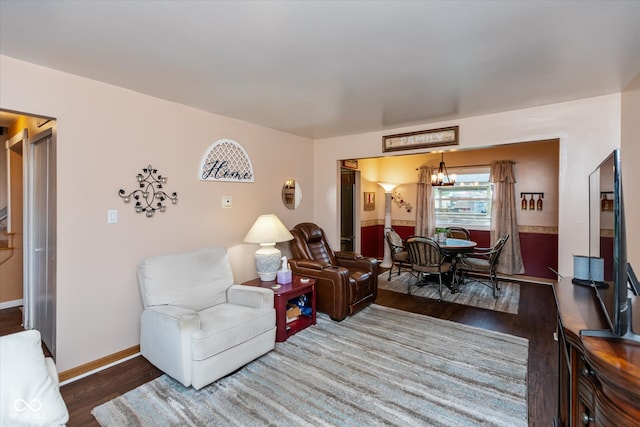 living room featuring hardwood / wood-style floors and a notable chandelier