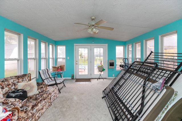 interior space with ceiling fan and lofted ceiling