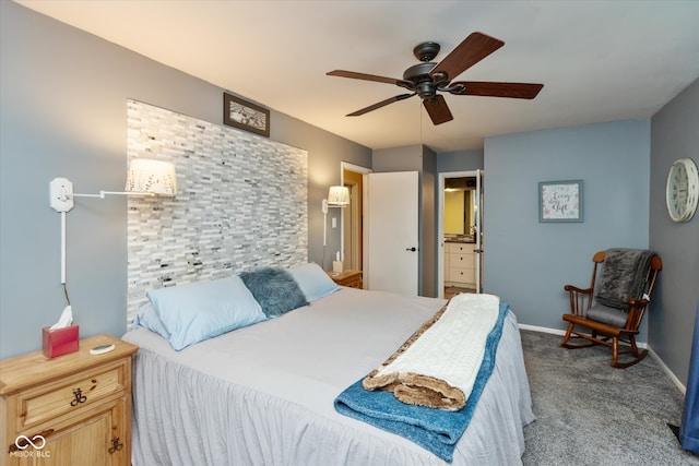 bedroom with ensuite bath, ceiling fan, and carpet floors