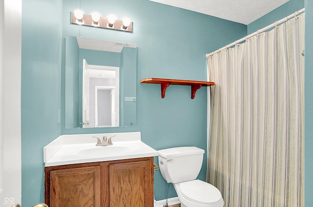 bathroom featuring a shower with curtain, vanity, a textured ceiling, and toilet