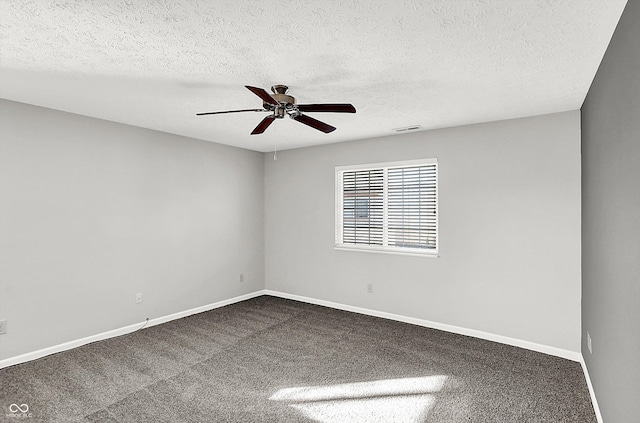 unfurnished room featuring carpet, a textured ceiling, and ceiling fan