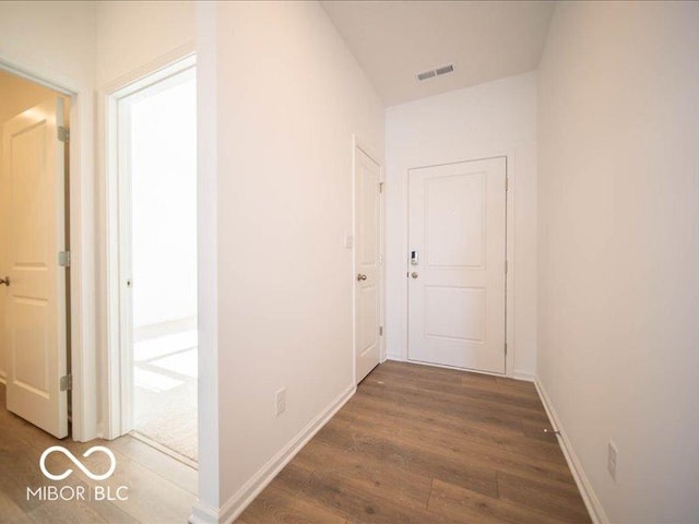 hall with dark hardwood / wood-style flooring