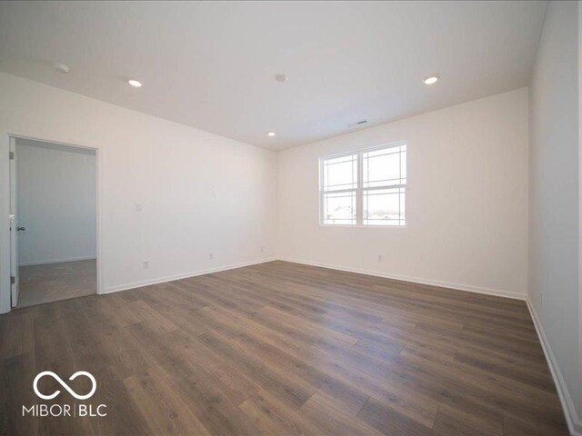 empty room featuring dark hardwood / wood-style floors