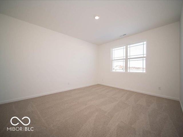 empty room featuring carpet flooring