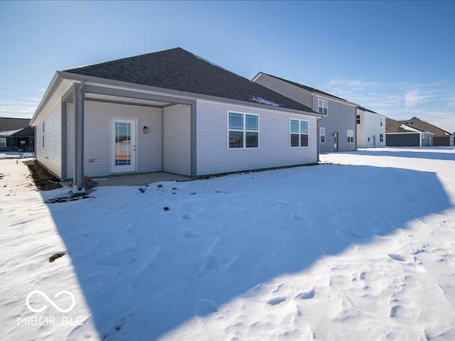 view of snow covered house