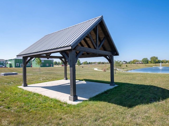 view of home's community featuring a gazebo, a water view, and a lawn