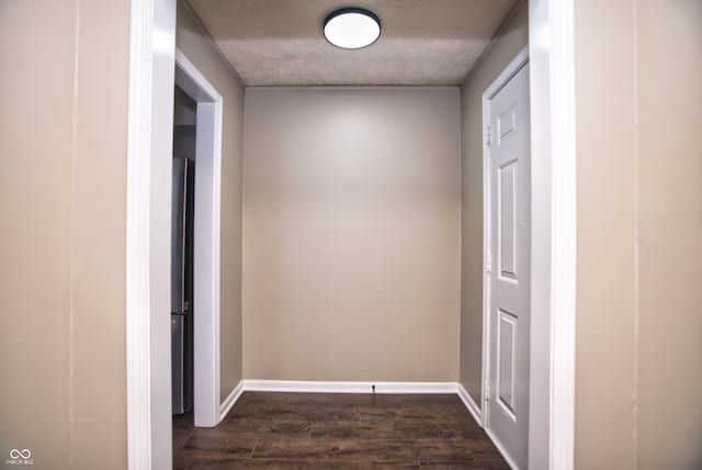 corridor featuring dark wood-type flooring