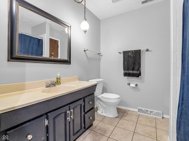 bathroom featuring curtained shower, tile patterned floors, a textured ceiling, toilet, and vanity