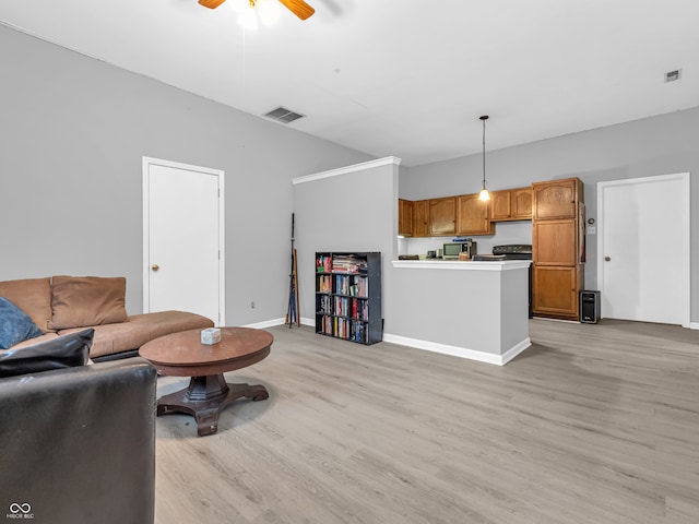 living room with ceiling fan and light wood-type flooring