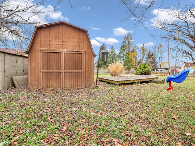 view of yard with a storage unit and a deck