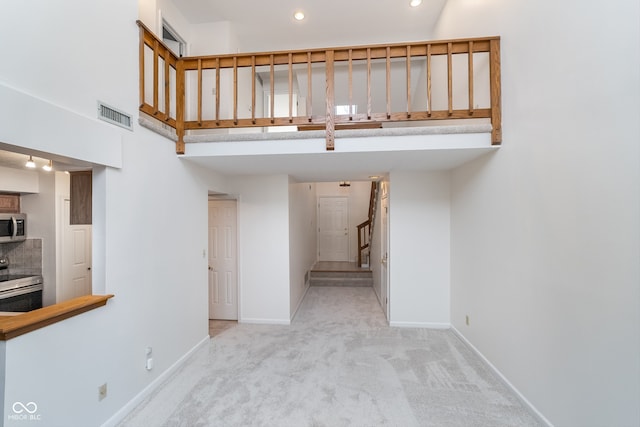 staircase with carpet floors