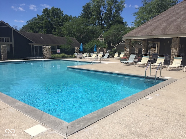 view of swimming pool with a patio