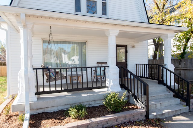 entrance to property featuring covered porch