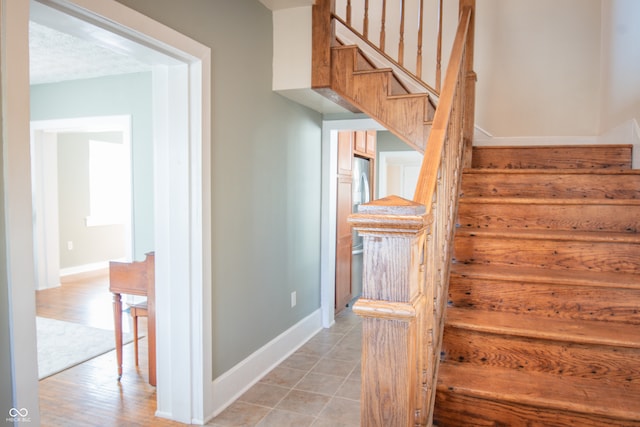 stairway featuring hardwood / wood-style floors