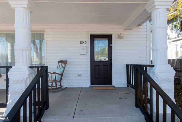 view of exterior entry featuring a porch