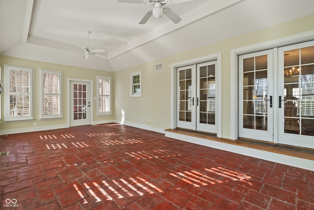 unfurnished sunroom with ceiling fan and french doors