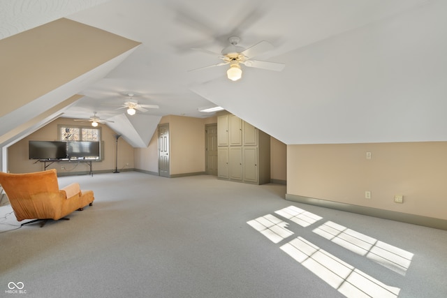 bonus room featuring light colored carpet, vaulted ceiling, and ceiling fan