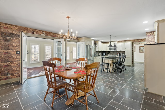 dining space featuring an inviting chandelier