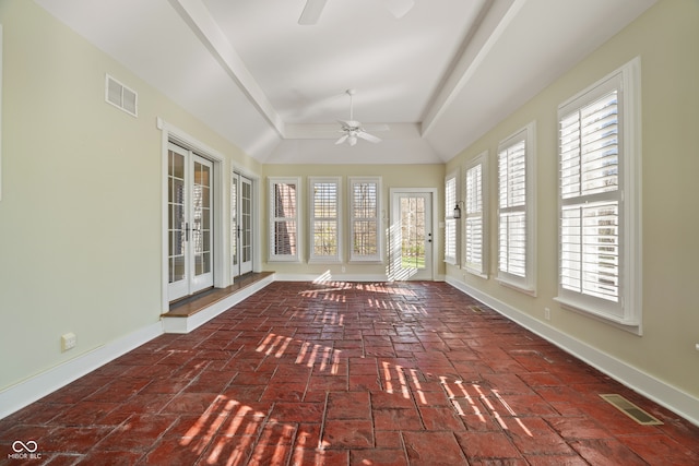 unfurnished sunroom with ceiling fan