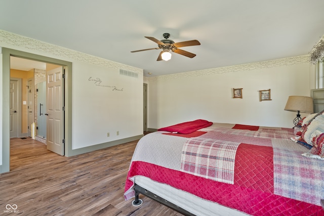 bedroom with hardwood / wood-style flooring and ceiling fan