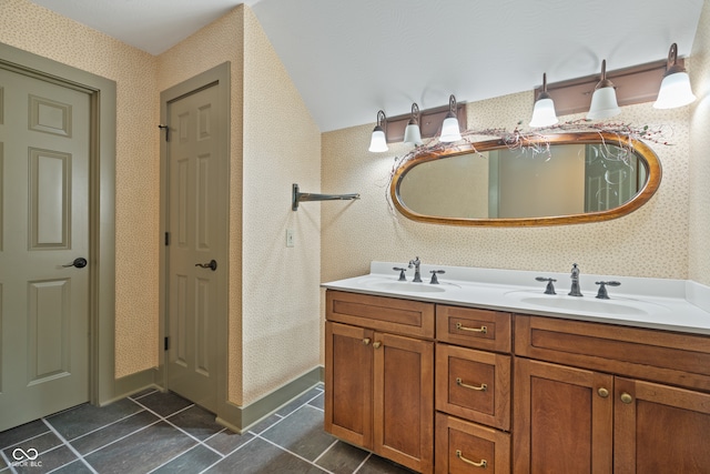 bathroom with tile patterned flooring and vanity