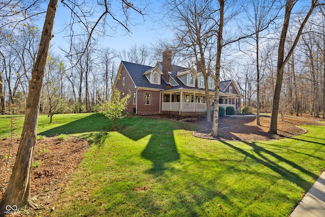 back of house featuring a yard and a porch