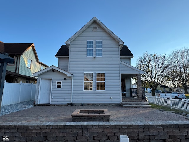 rear view of house with a patio