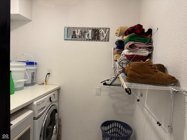 laundry room with washer and clothes dryer