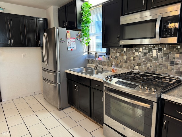 kitchen featuring decorative backsplash, sink, and stainless steel appliances