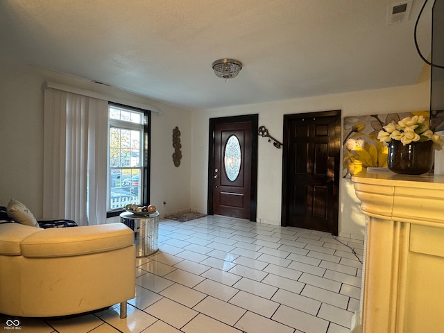 entryway featuring light tile patterned floors