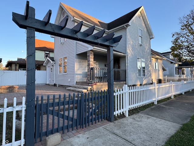 view of front of house with a pergola