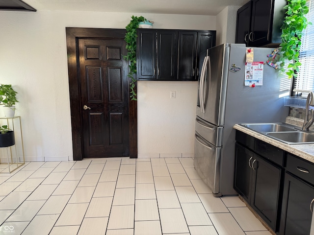 kitchen with stainless steel refrigerator and sink