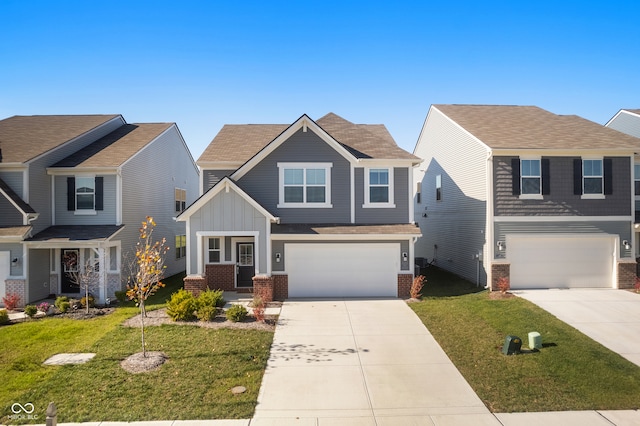 craftsman house featuring a garage and a front lawn