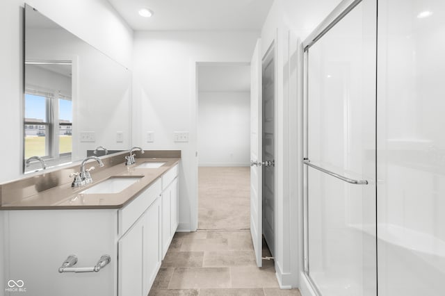 bathroom with vanity and walk in shower