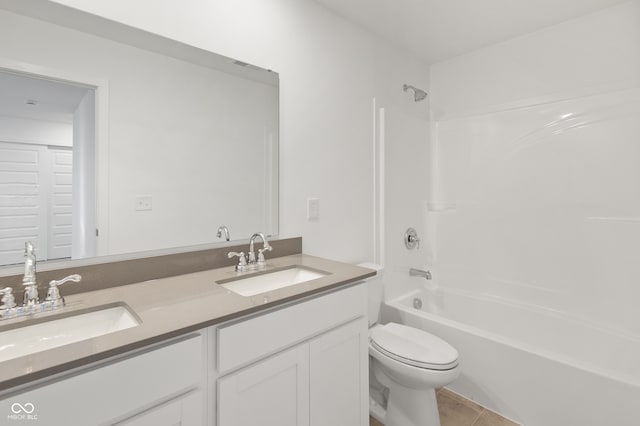 full bathroom featuring tile patterned floors, vanity, bathing tub / shower combination, and toilet