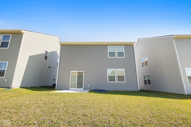 rear view of house with a lawn