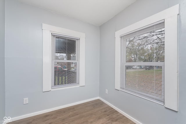 unfurnished room featuring hardwood / wood-style floors