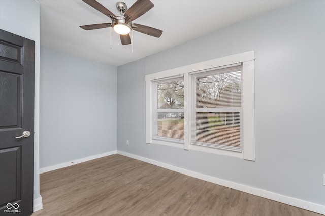 unfurnished room with hardwood / wood-style flooring and ceiling fan