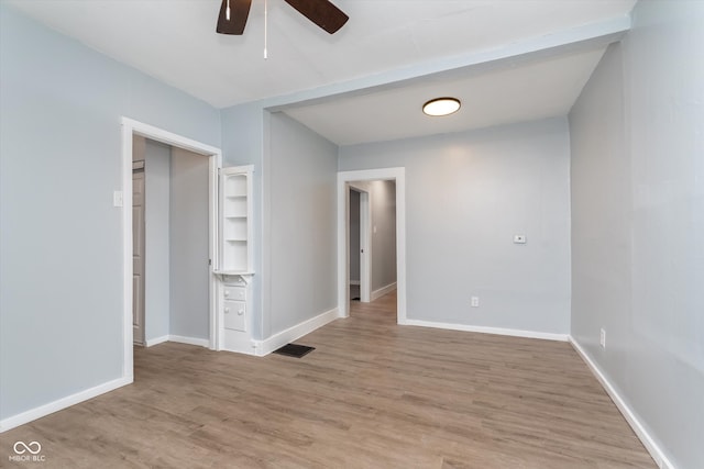 spare room featuring ceiling fan and light hardwood / wood-style flooring