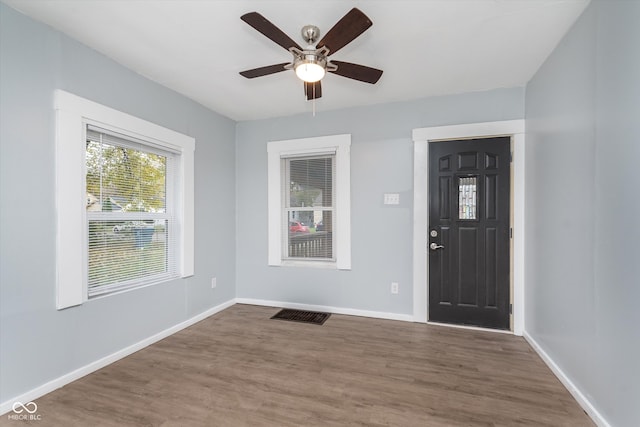 foyer featuring ceiling fan and dark hardwood / wood-style floors