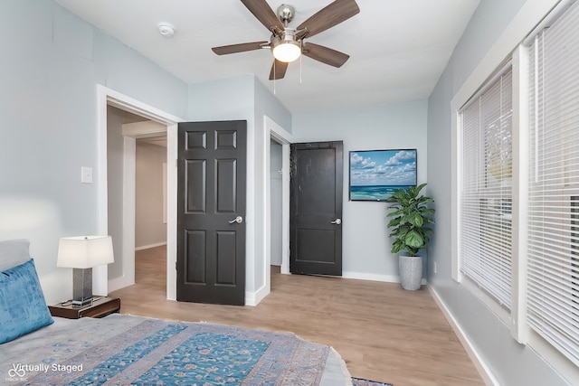 bedroom featuring light hardwood / wood-style flooring and ceiling fan