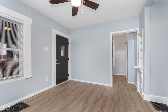 interior space with light hardwood / wood-style flooring and ceiling fan